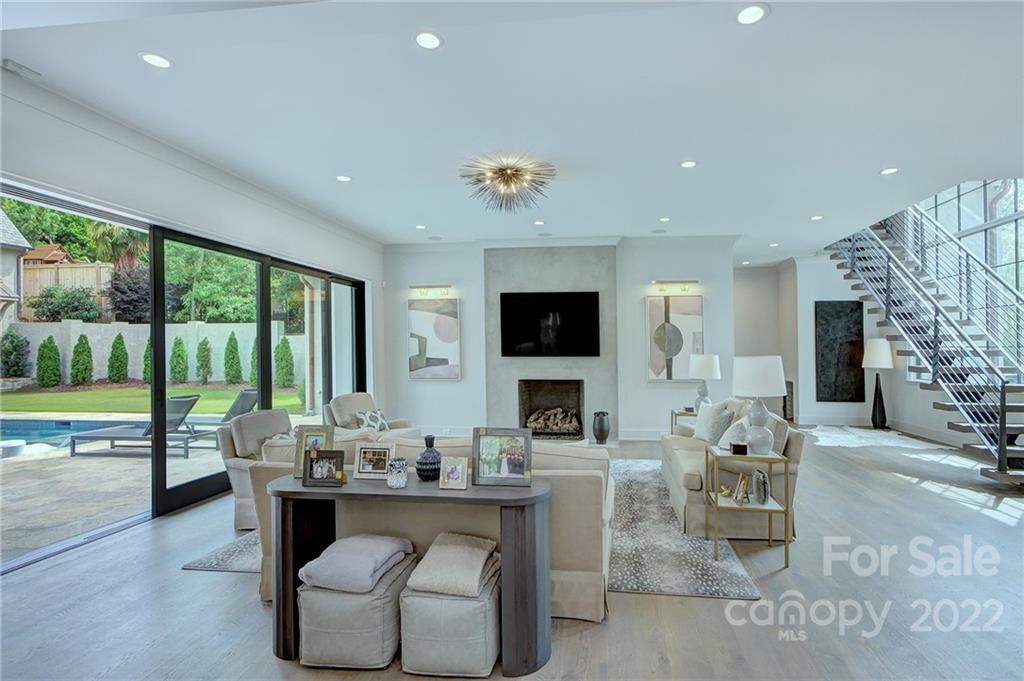 2027 Ferncliff Road Charlotte, NC 28211 - Photo 13 of 46 a living room with fireplace furniture and a flat screen tv