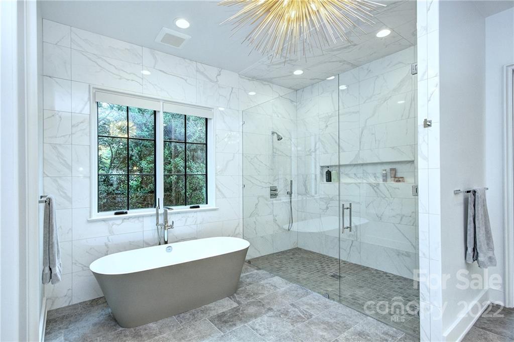 2027 Ferncliff Road Charlotte, NC 28211 - Photo 32 of 46 a spacious bathroom with a large tub shower and sink