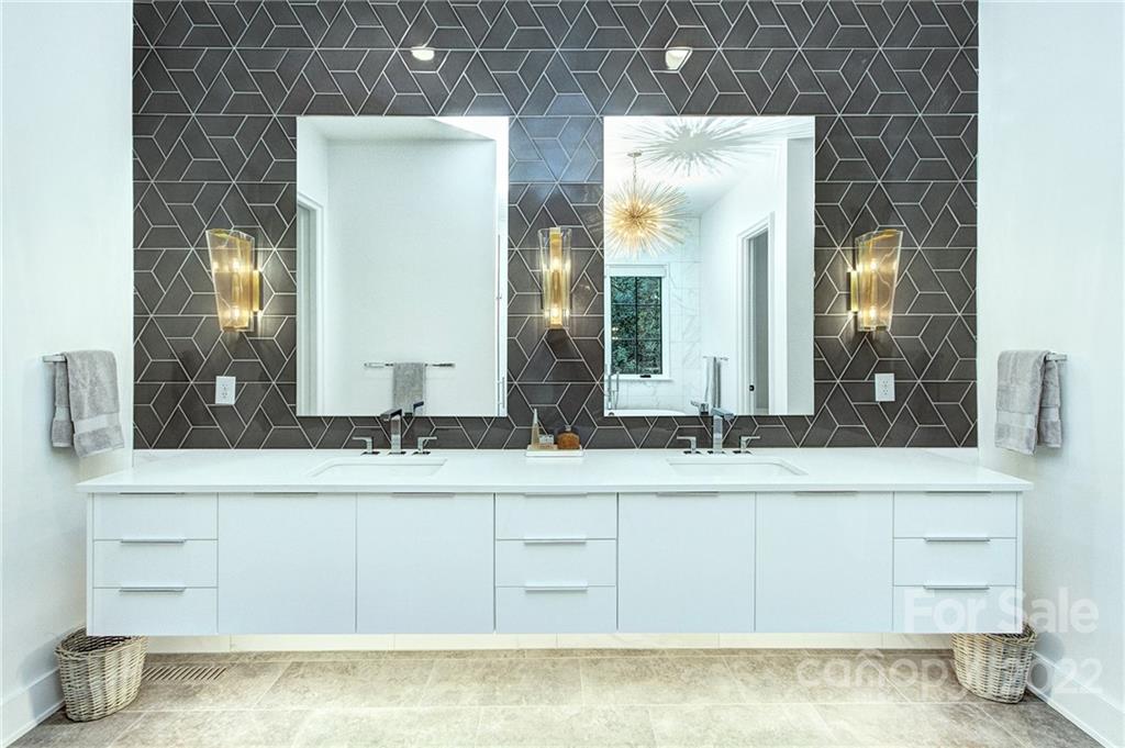 2027 Ferncliff Road Charlotte, NC 28211 - Photo 33 of 46 a bathroom with a sink and a mirror