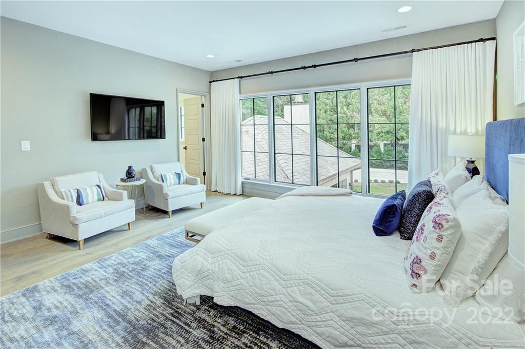 2027 Ferncliff Road Charlotte, NC 28211 - Photo 39 of 46 a bedroom with a bed and a flat screen tv