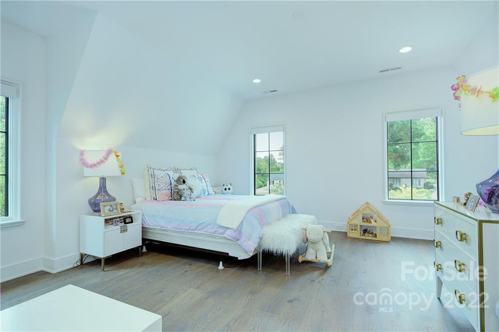 2027 Ferncliff Road Charlotte, NC 28211 - Photo 43 of 46 a bed room with a bed and a window