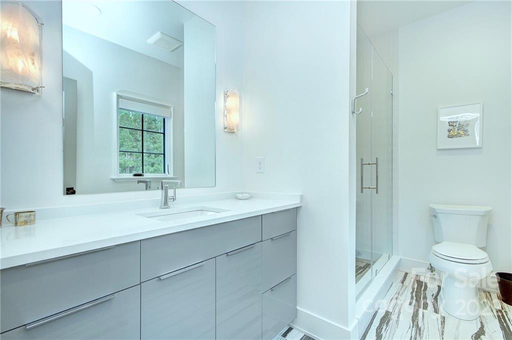 2027 Ferncliff Road Charlotte, NC 28211 - Photo 46 of 46 a bathroom with a sink and a toilet