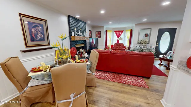 a view of a livingroom with furniture and a workspace