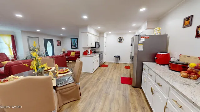 a view of living room filled with furniture and toys