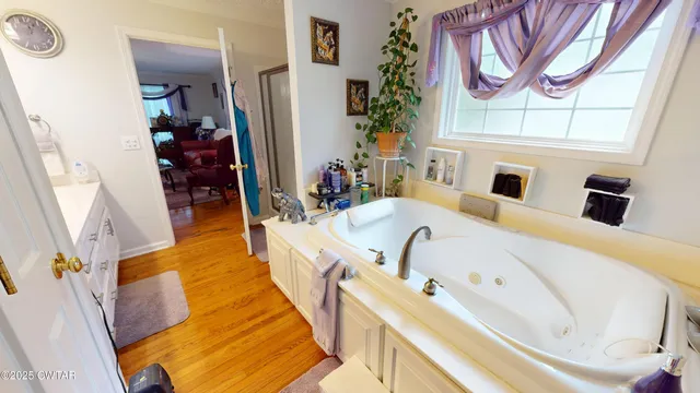 a bed room with a bed and a chandelier