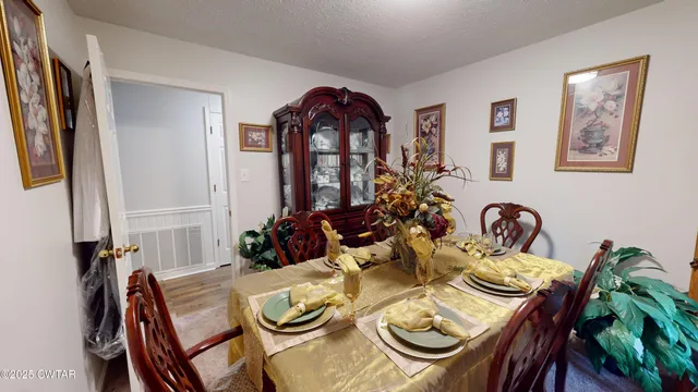 a bathroom with a toilet and a shower curtain