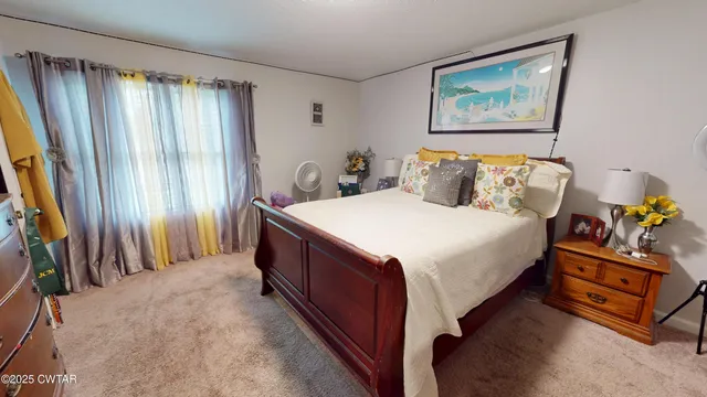 a front view of a house with a garden and porch