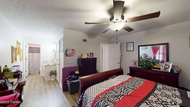 a car parked in front of white house