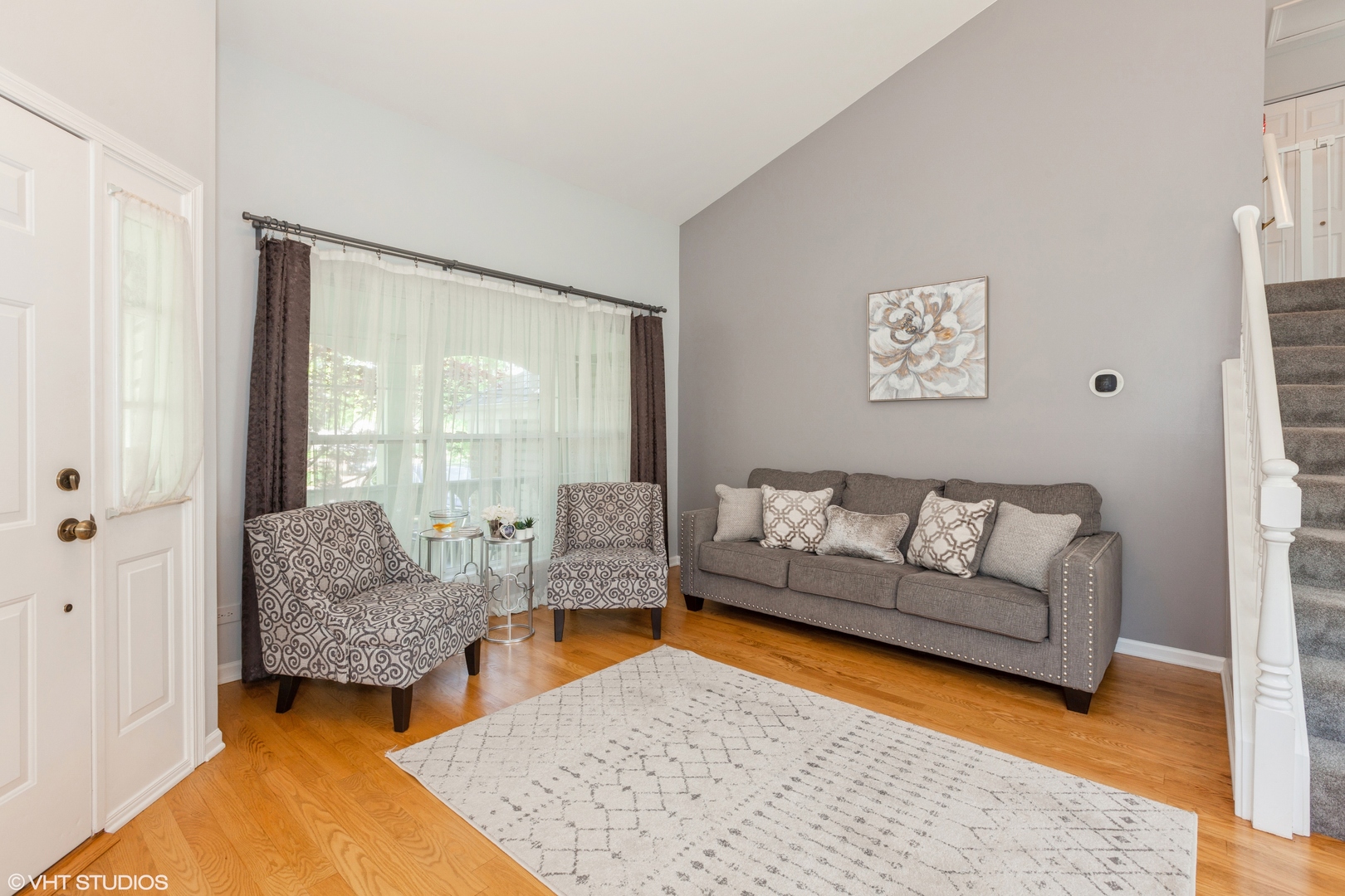 724 Wildflower Circle Naperville, IL 60540 - Photo 3 of 31 a living room with furniture and a large window