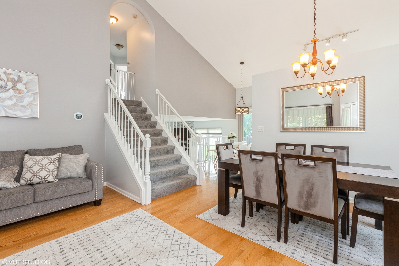 724 Wildflower Circle Naperville, IL 60540 - Photo 7 of 31 a view of a dining room with furniture and wooden floor