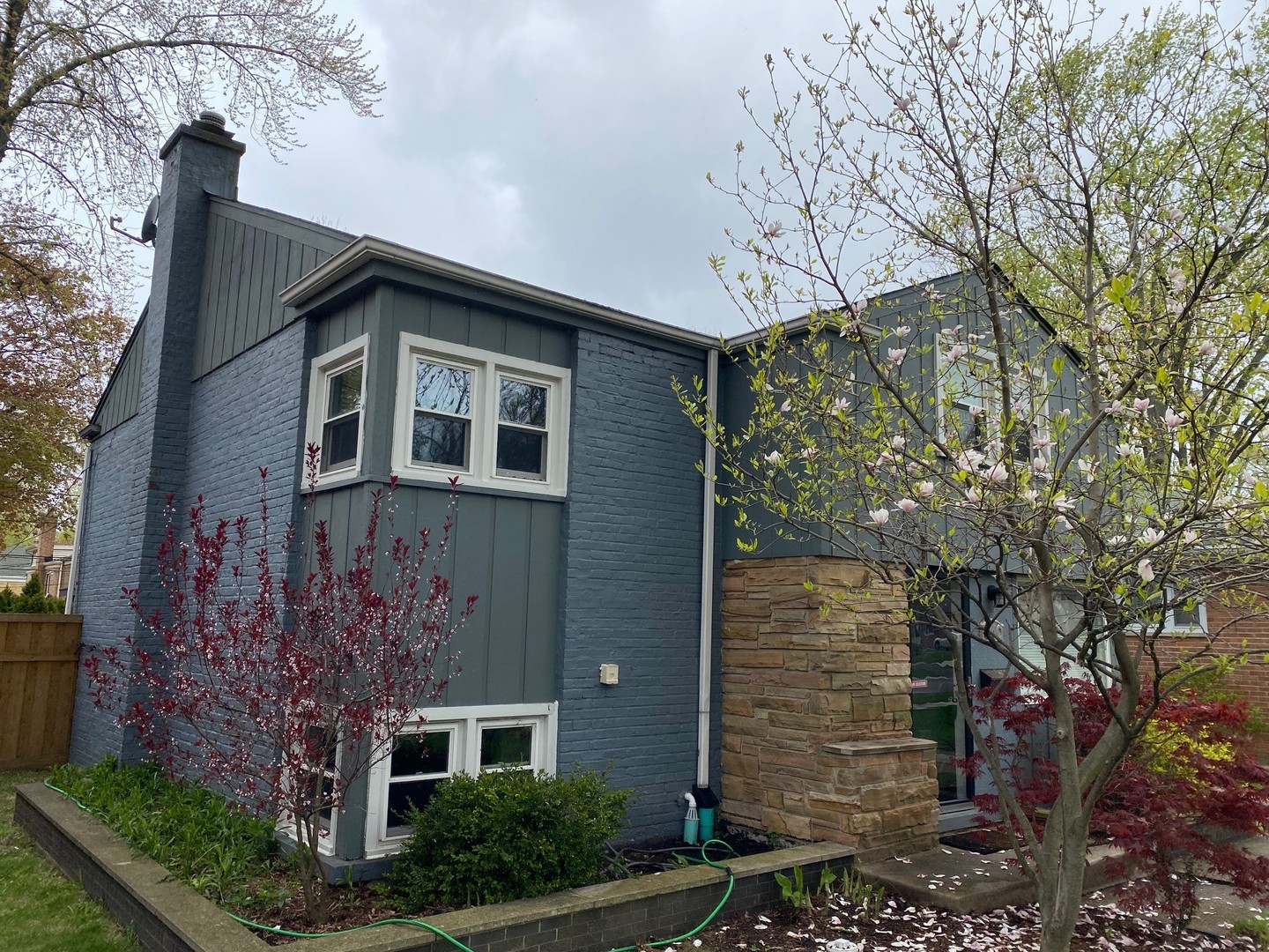 640 Long Road Glenview, IL 60025 - Photo 2 of 3 a front view of a house with garden