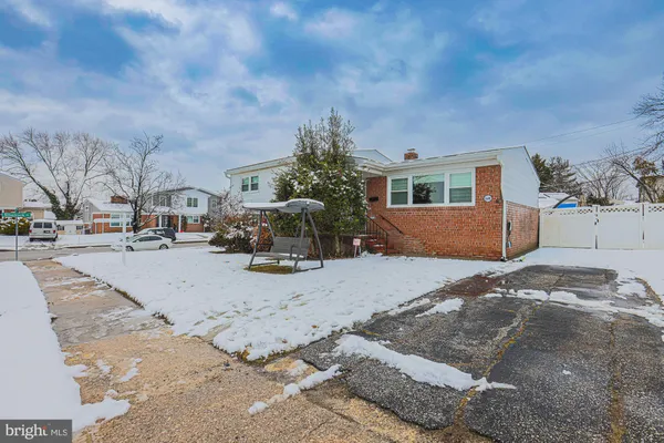 a view of the house with a yard
