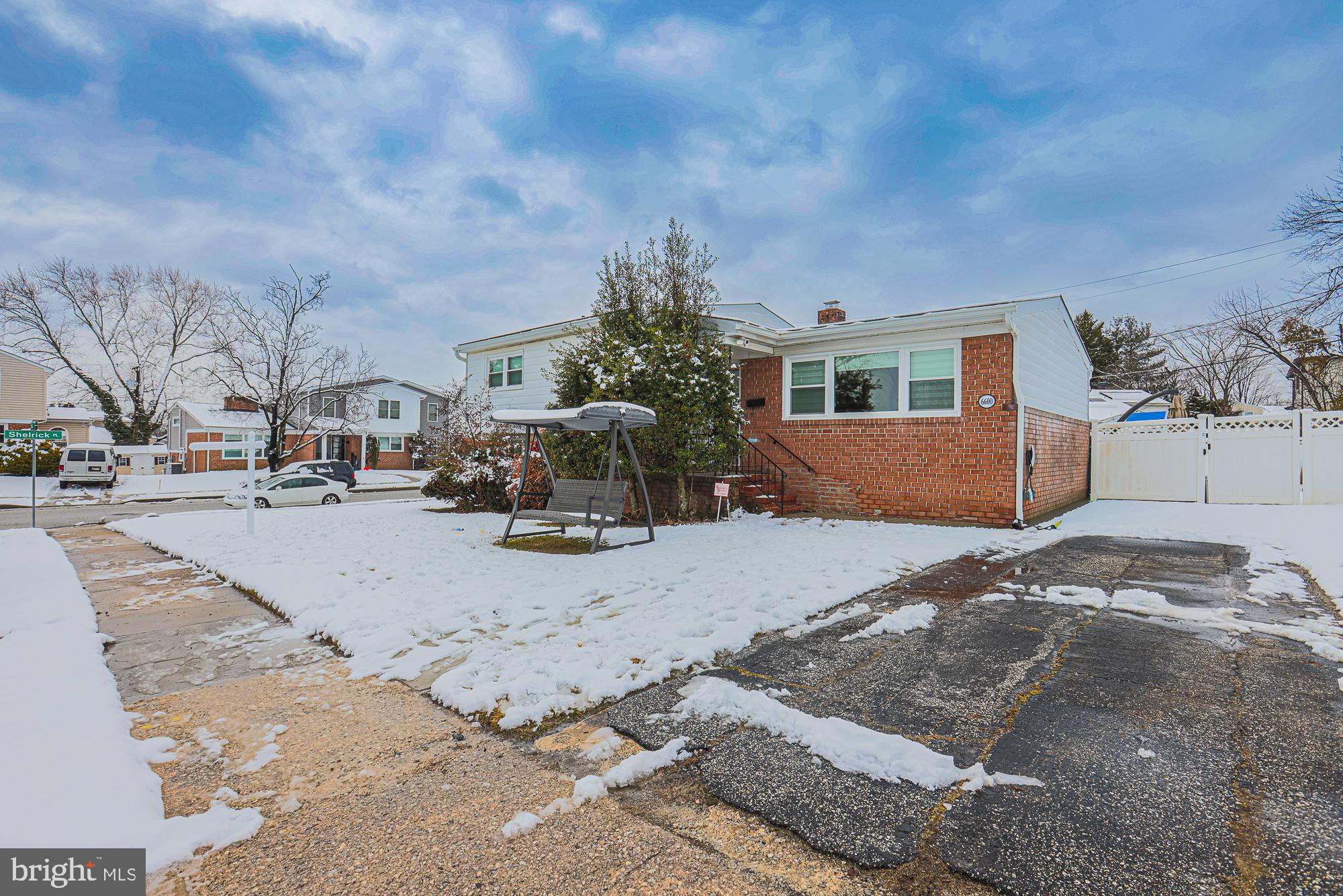 a view of the house with a yard