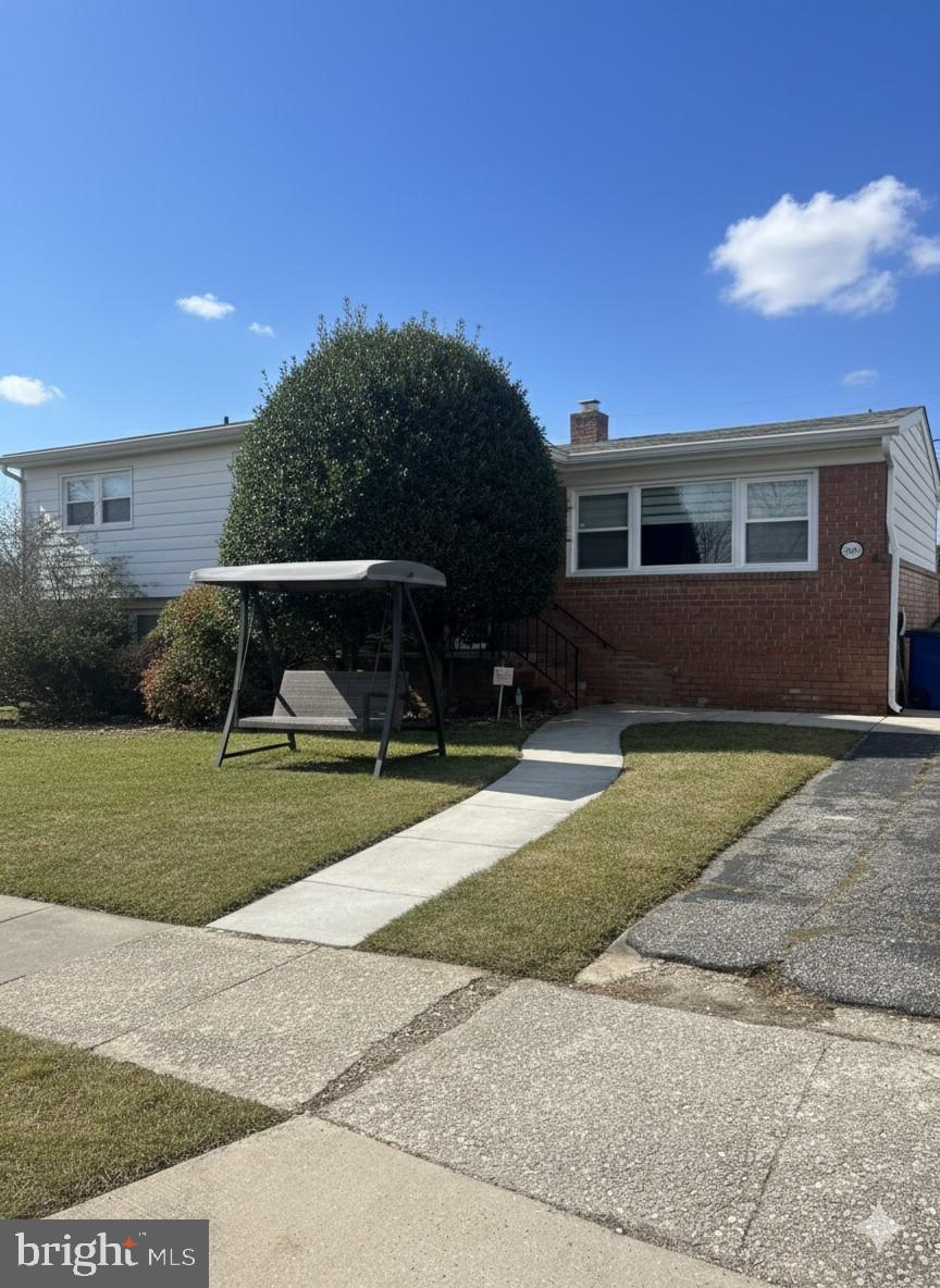 Charming home with inviting front yard.
