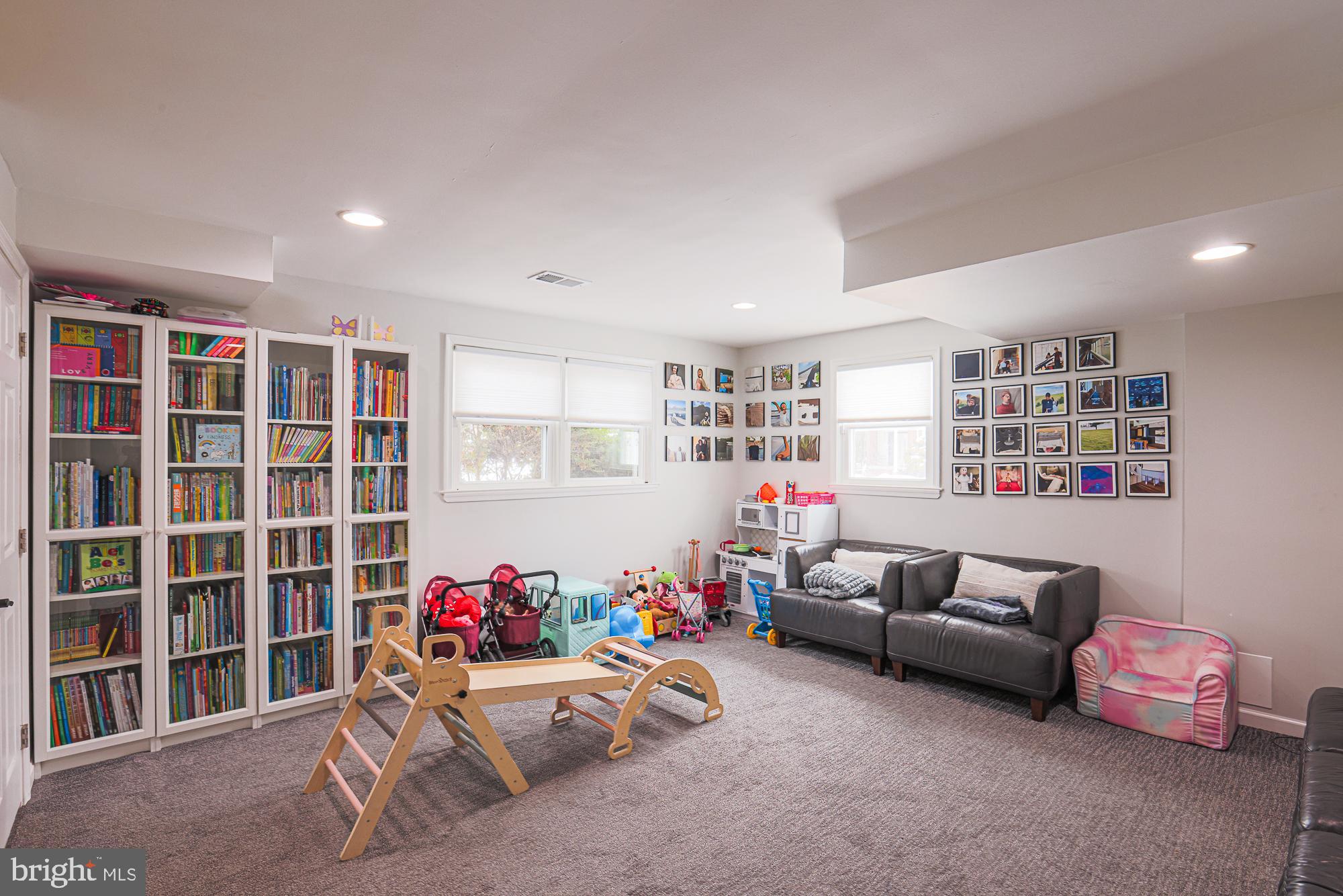 6600 Linco Avenue Baltimore, MD 21209 - Photo 16 of 22 a living room with furniture and a book shelf