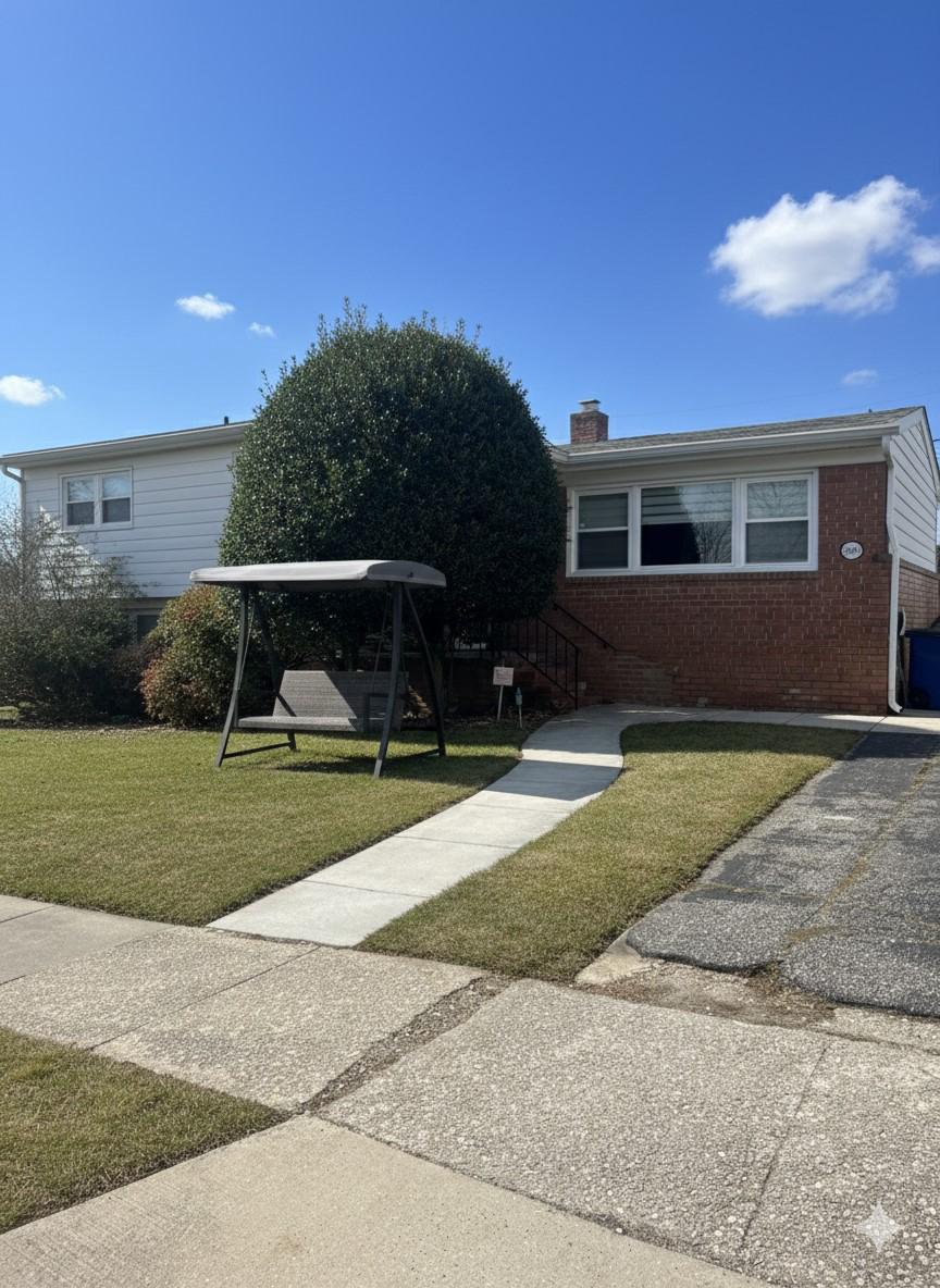 6600 Linco Avenue Baltimore, MD 21209 - Photo 2 of 24 a front view of a house with a yard and garage