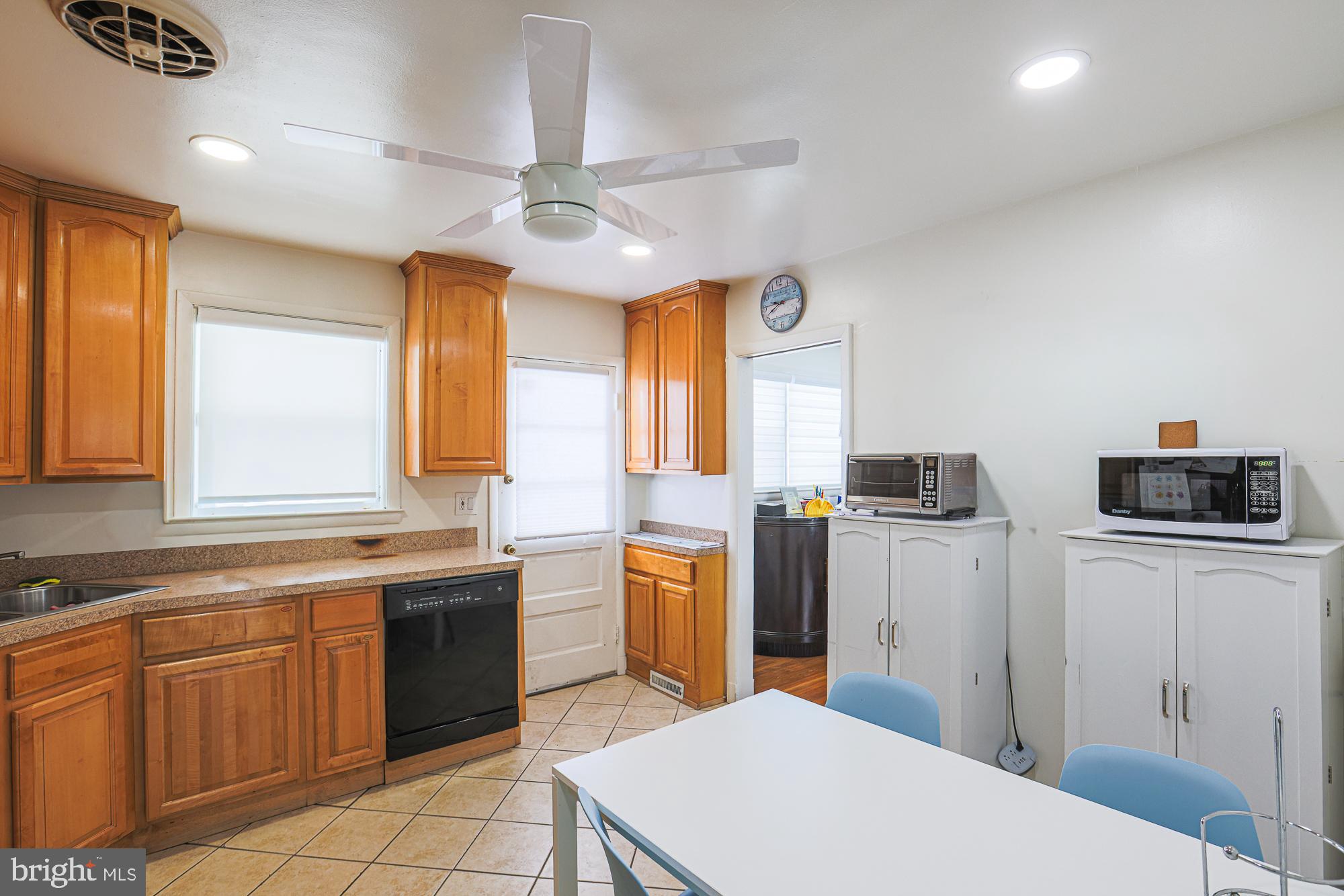6600 Linco Avenue Baltimore, MD 21209 - Photo 3 of 24 a kitchen with stainless steel appliances a stove refrigerator sink and microwave