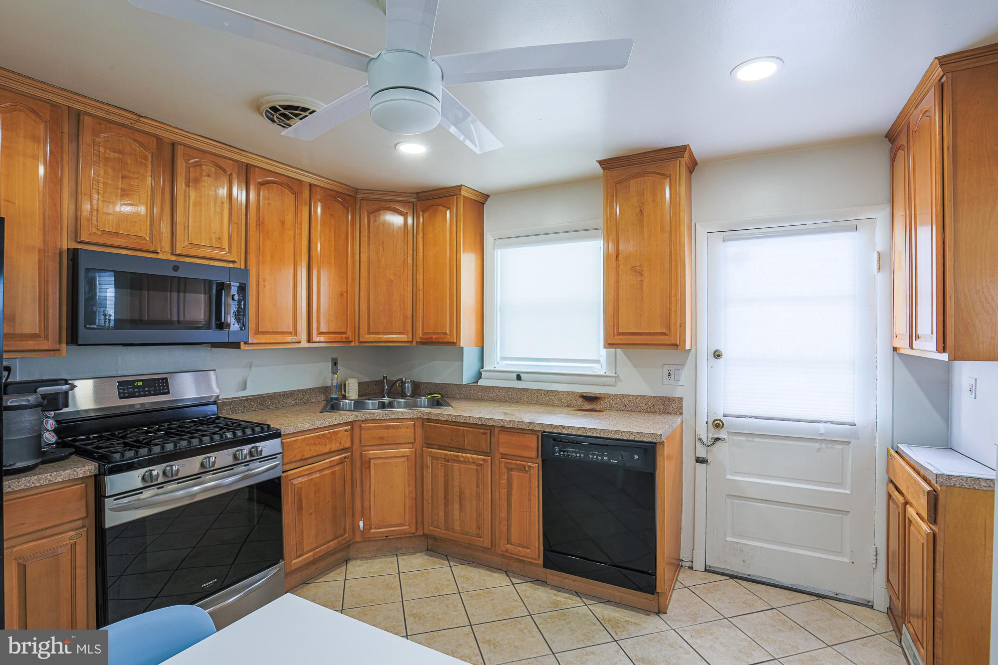 6600 Linco Avenue Baltimore, MD 21209 - Photo 3 of 21 Bright kitchen with warm wood cabinetry.
