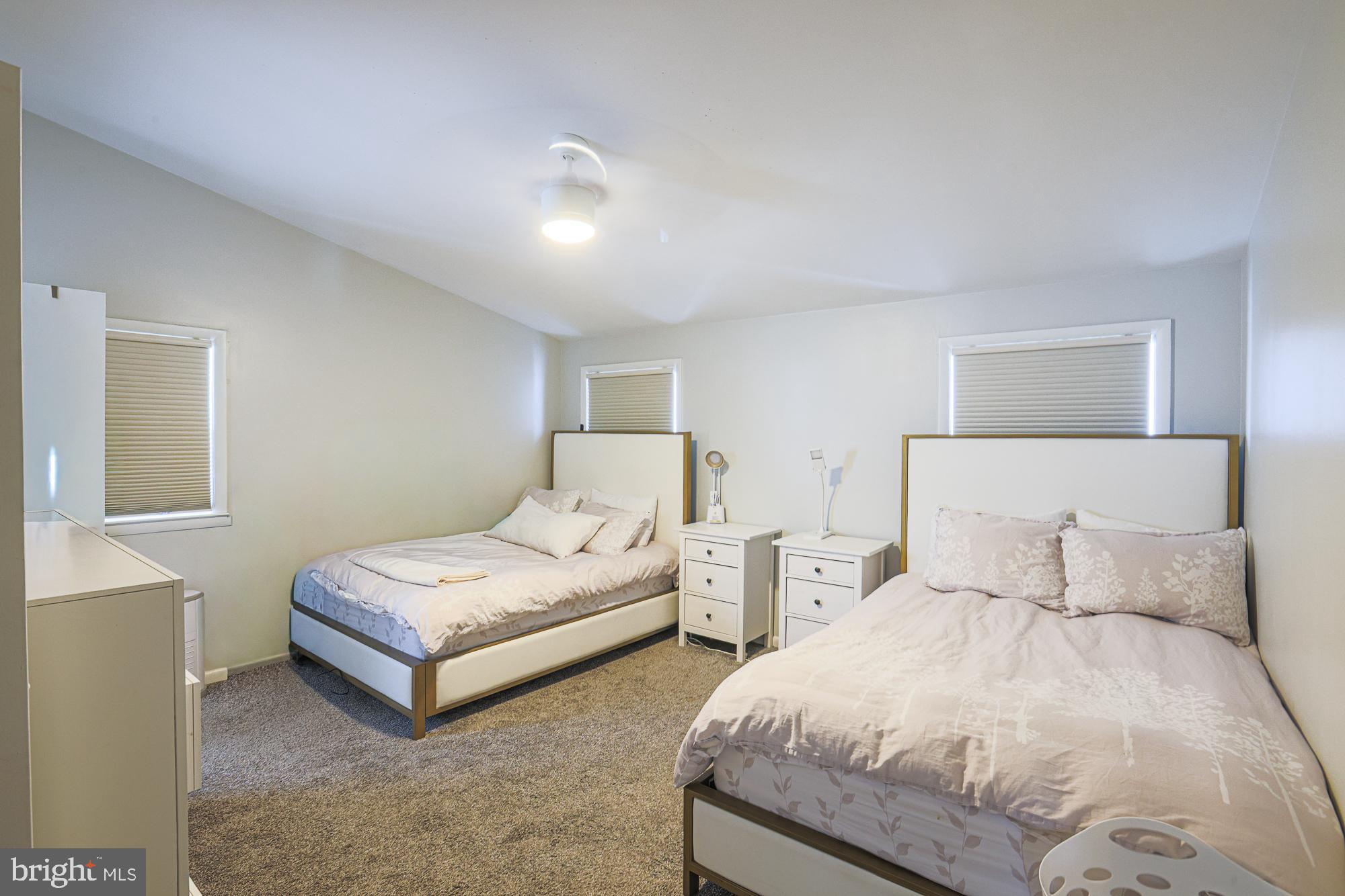 6600 Linco Avenue Baltimore, MD 21209 - Photo 9 of 24 a bedroom with two beds and a night stand