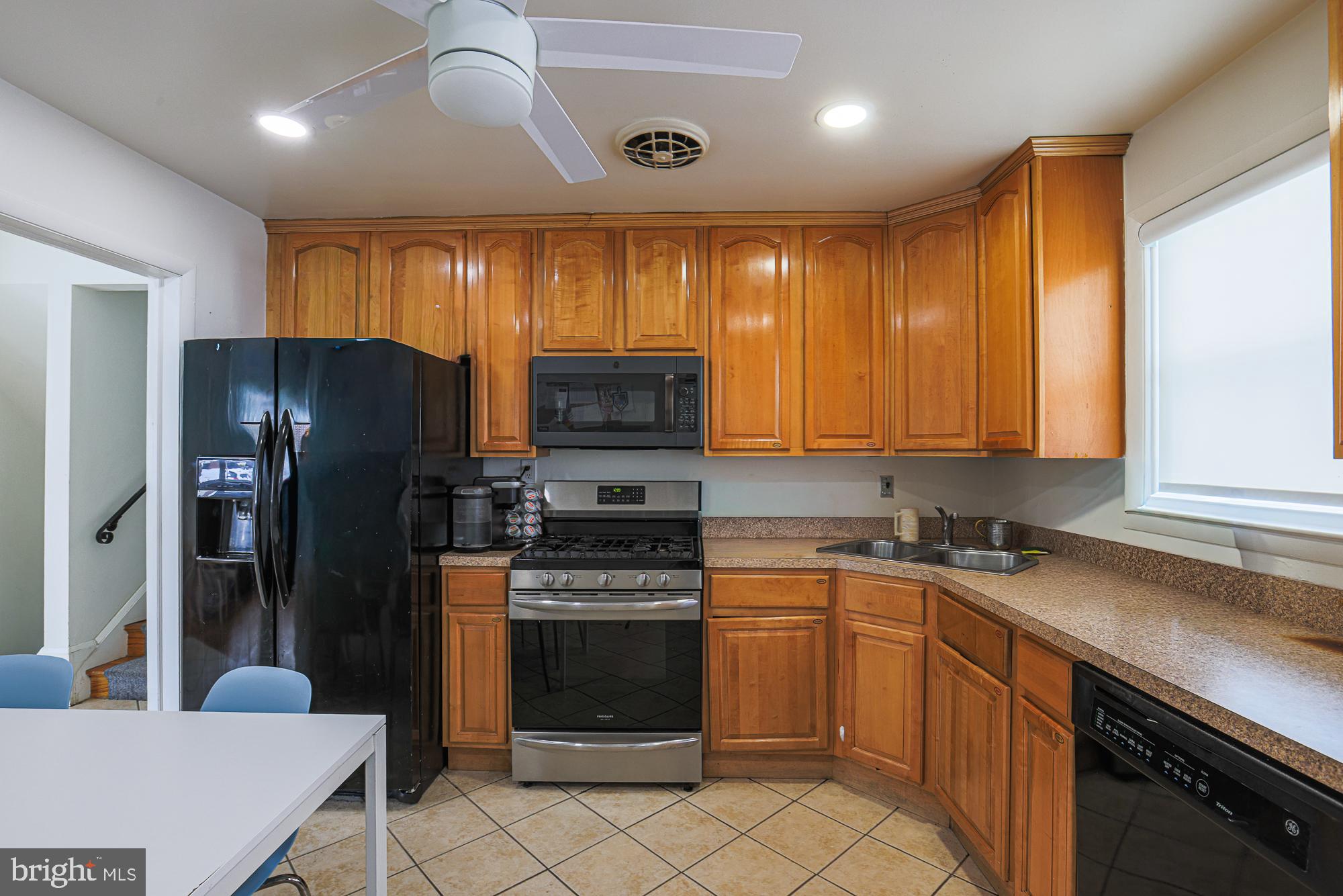 6600 Linco Avenue Baltimore, MD 21209 - Photo 9 of 21 Modern kitchen with warm wood cabinetry.