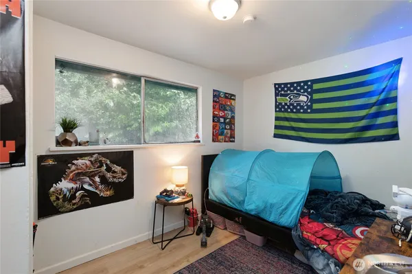 a white toilet sitting next to a bath tub