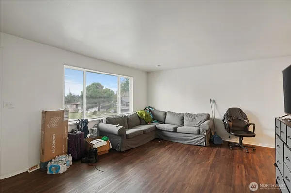 a view of a livingroom with furniture and a flat screen tv