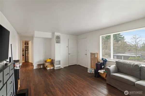 a view of a dining room with furniture and wooden floor