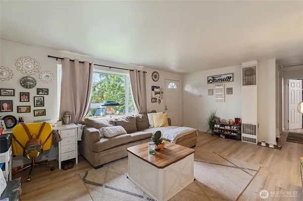 a kitchen with sink cabinets and wooden floor