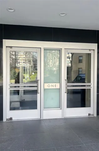 a view of a living room with a large window
