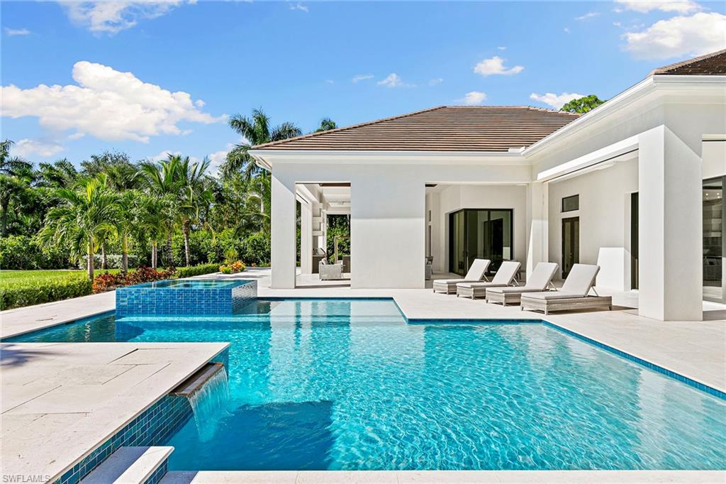 a view of a house with patio and wooden floor