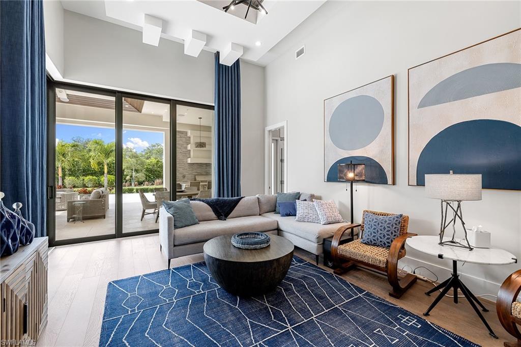 607 Myrtle Road Naples, FL 34108 - Photo 34 of 45 a living room with furniture and a large window