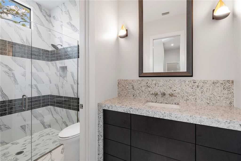 607 Myrtle Road Naples, FL 34108 - Photo 41 of 45 a bathroom with a sink and toilet