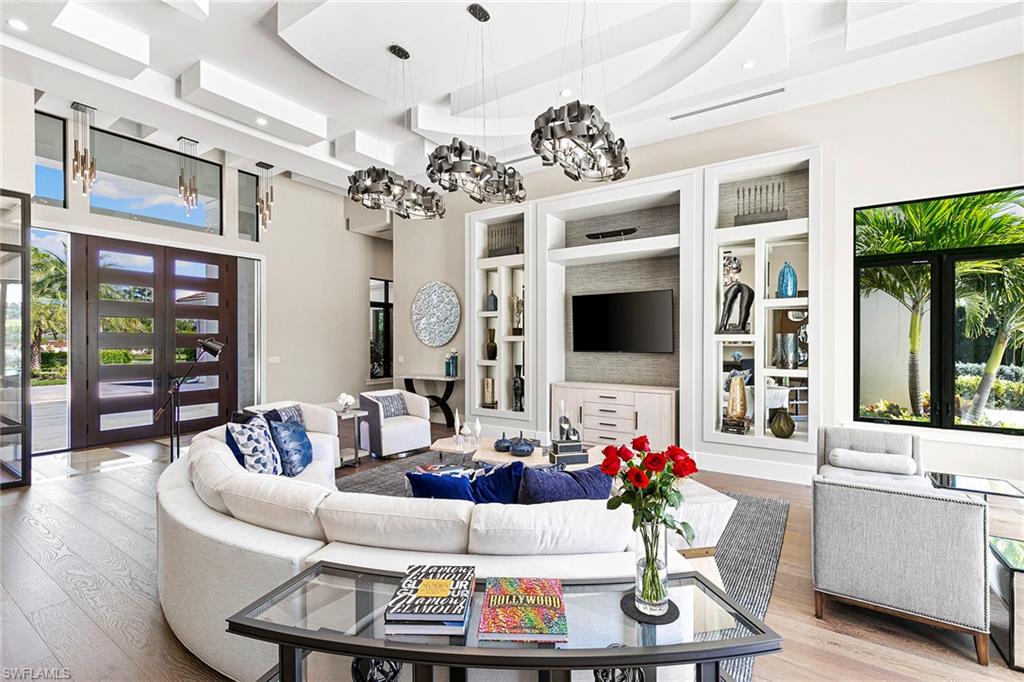 607 Myrtle Road Naples, FL 34108 - Photo 7 of 45 a living room with furniture and flat screen tv