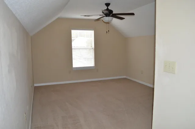 a bathroom with a toilet and a bathtub