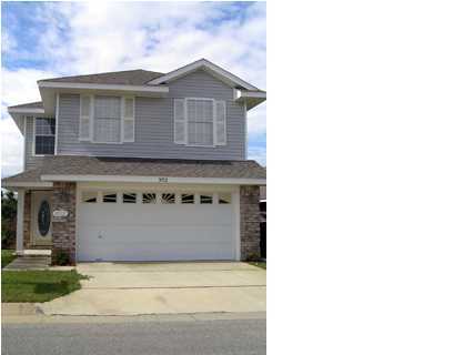 a front view of a house with a garage