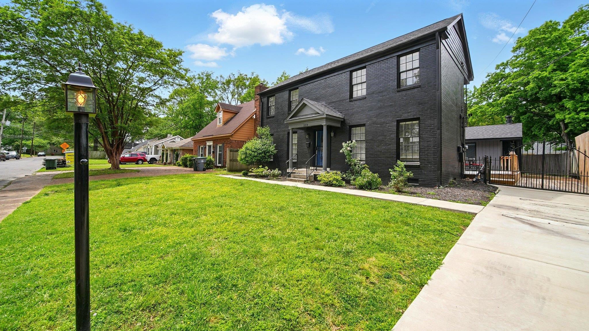 359 South Fenwick Road Memphis, TN 38111 - Photo 3 of 31 View of front facade featuring brick siding and a gate
