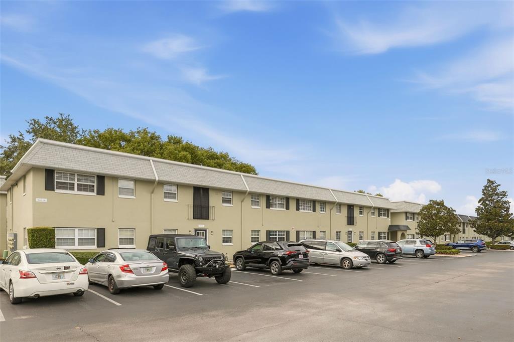 525 South Conway Road, Unit 70 Orlando, FL 32807 - Photo 11 of 28 a view of a cars park in front of a house