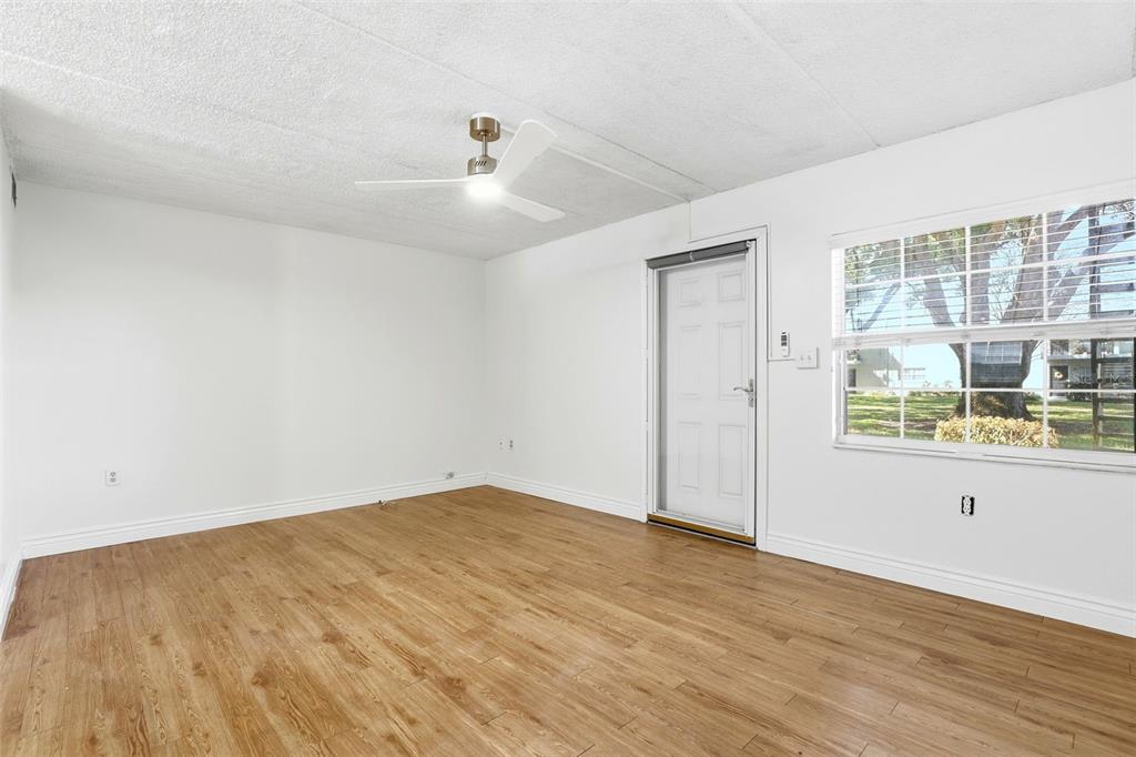 525 South Conway Road, Unit 70 Orlando, FL 32807 - Photo 2 of 28 wooden floor in an empty room