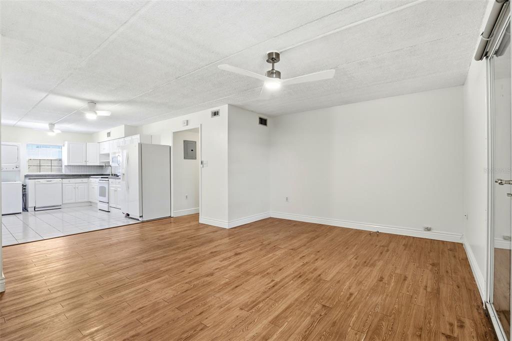 525 South Conway Road, Unit 70 Orlando, FL 32807 - Photo 23 of 28 an empty room with wooden floor and windows