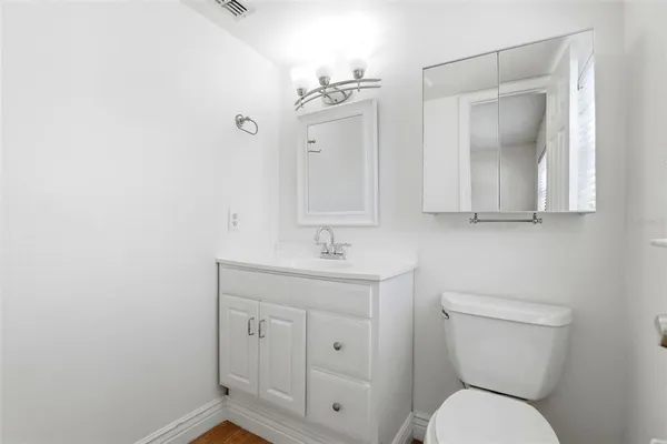 a view of walk in closet with clothes