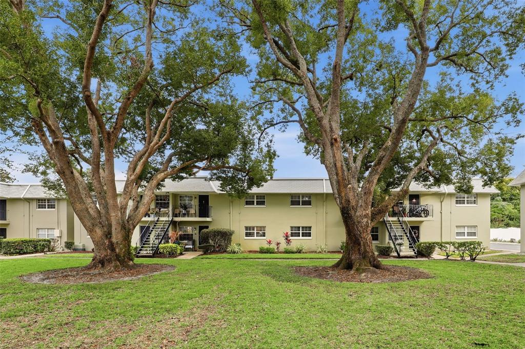 525 South Conway Road, Unit 70 Orlando, FL 32807 - Photo 6 of 28 a view of a yard in front of a house