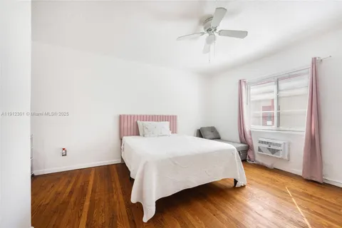 a bedroom with a bed and a table with closet