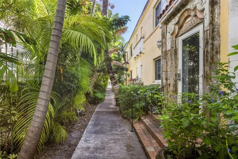 a view of a pathway with plants