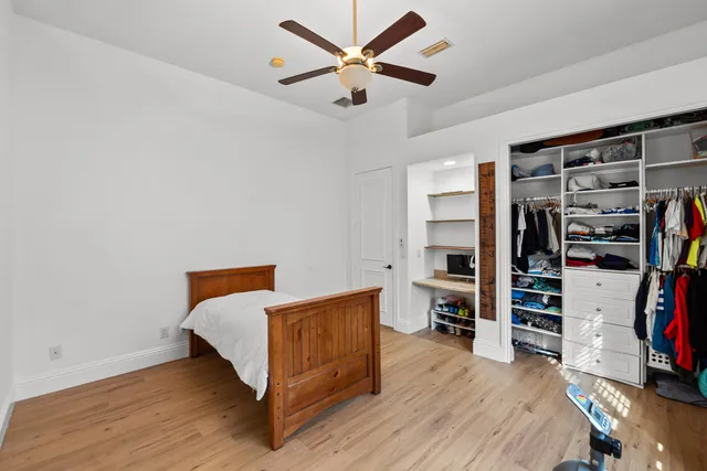 a living room with furniture and a book shelf