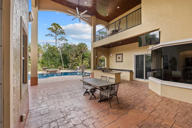 a backyard of a house with outdoor seating