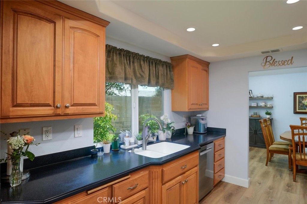 10424 Cartilla Court Rancho Cucamonga, CA 91737 - Photo 9 of 36 a kitchen with stainless steel appliances granite countertop a sink a counter space and cabinets