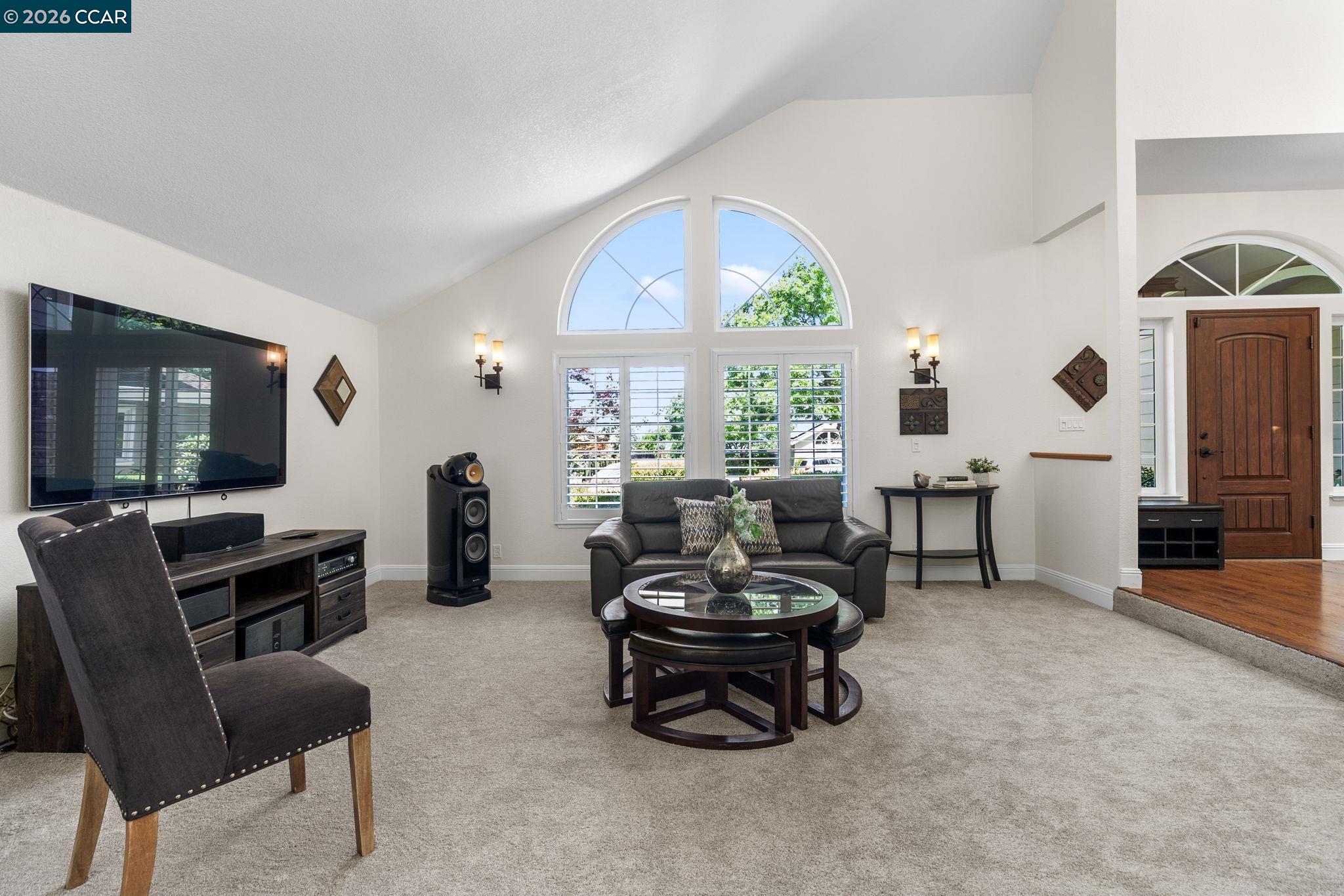 1267 Quiet Circle Concord, CA 94521 - Photo 12 of 72 a living room with furniture and a flat screen tv