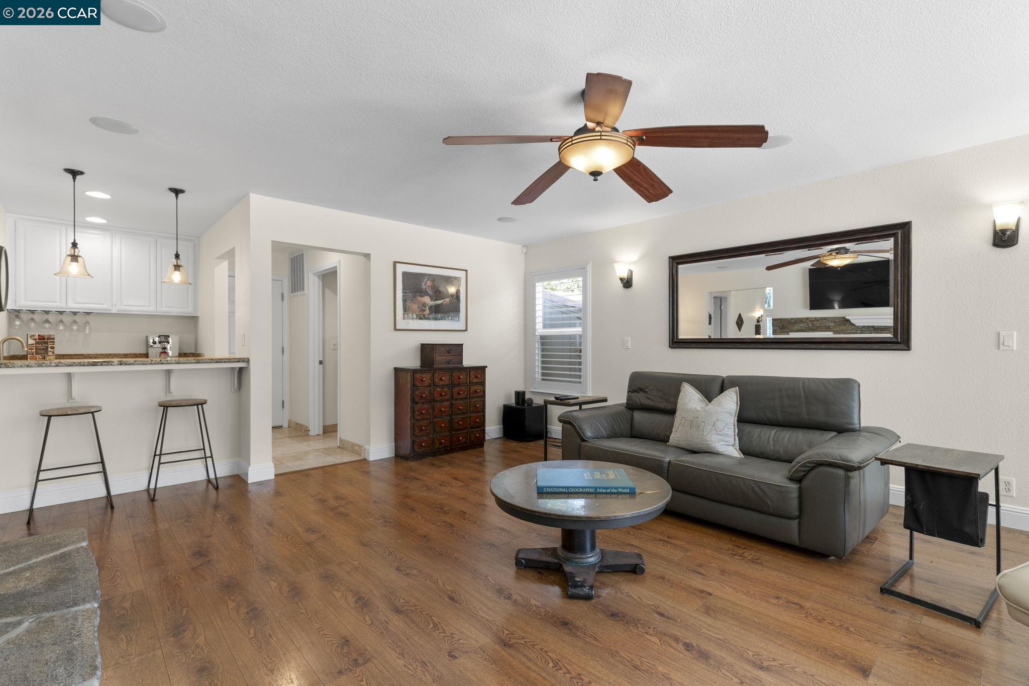 1267 Quiet Circle Concord, CA 94521 - Photo 13 of 72 a living room with furniture and a kitchen view