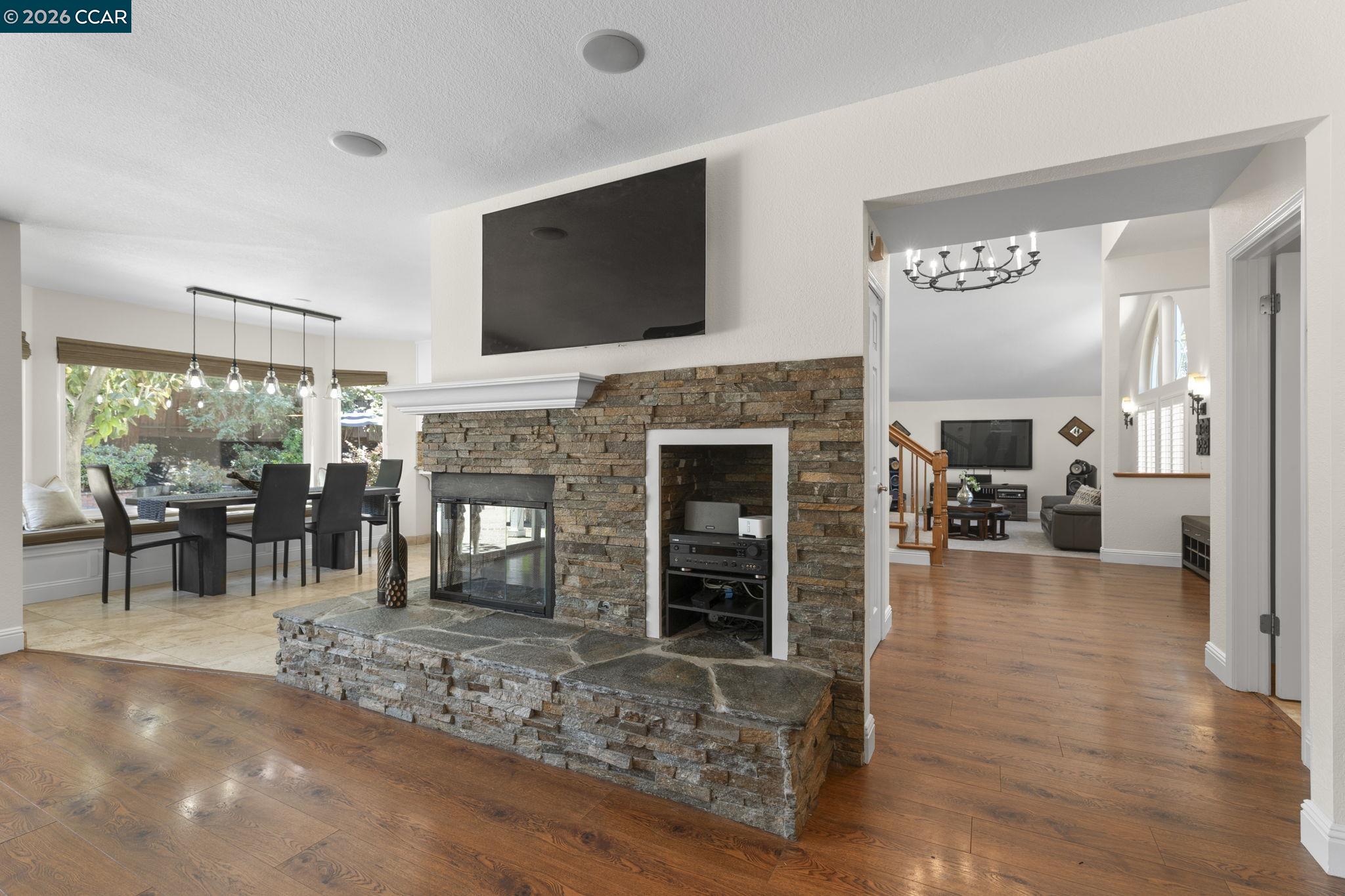 1267 Quiet Circle Concord, CA 94521 - Photo 16 of 72 a living room with furniture a flat screen tv and a fireplace