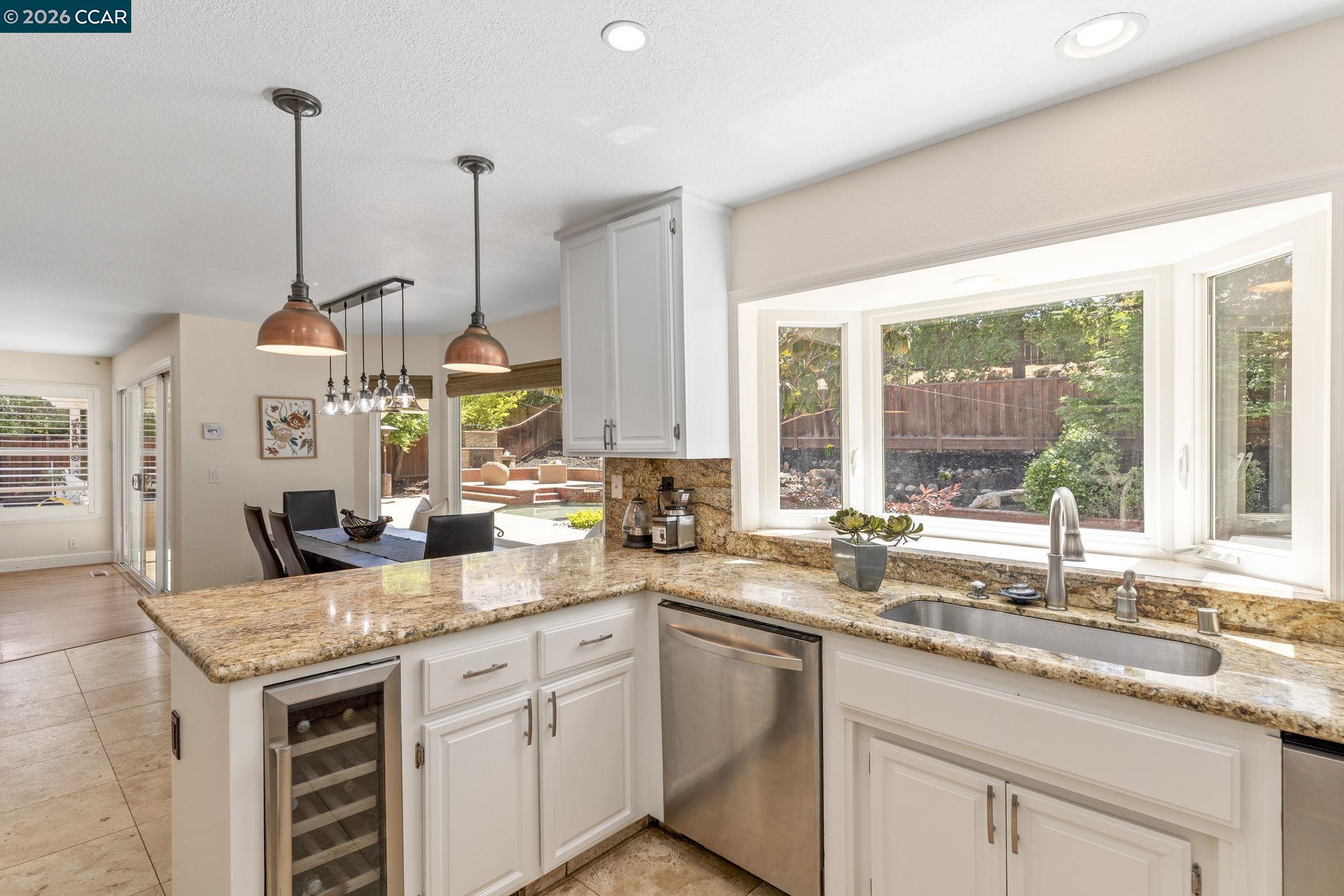 1267 Quiet Circle Concord, CA 94521 - Photo 24 of 72 a kitchen with sink stove and cabinets